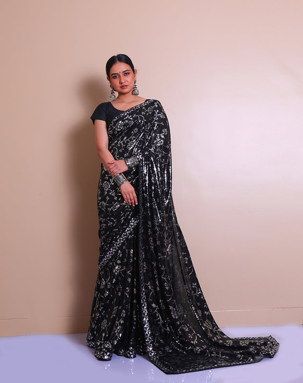 The black blended georgette saree with silver and black sequence embroidery sounds absolutely glamorous - BLN01320