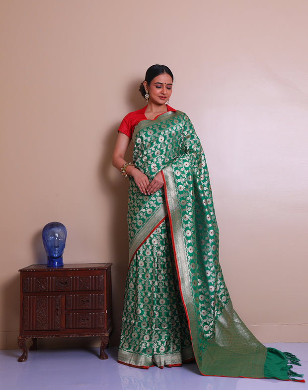 The green Banarsi silk Handloom saree with gold zari woven details all over the drape, border - BSK09932