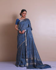 The indigo Tussar printed saree with a zari border and pallu sounds like a contemporary take on traditional elegance. - PTS05288