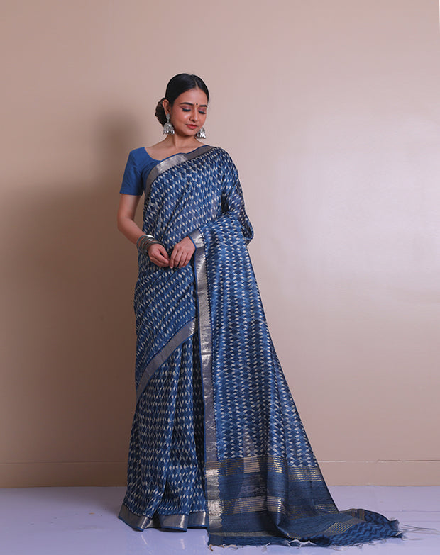 The indigo Tussar printed saree with a zari border and pallu sounds like a contemporary take on traditional elegance. - PTS05288