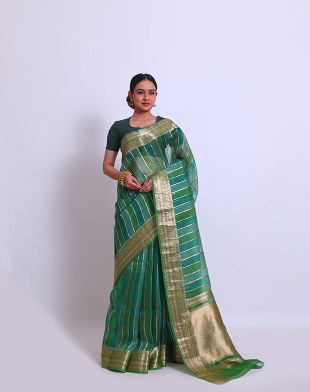 The green organza saree with zari vertical lines woven all over the drape sounds elegant and sophisticated - BSK010624