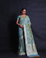 The Green Banarasi silk saree you're describing sounds exquisite and intricate.- BSK010452
