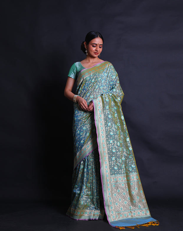 The Green Banarasi silk saree you're describing sounds exquisite and intricate.- BSK010452