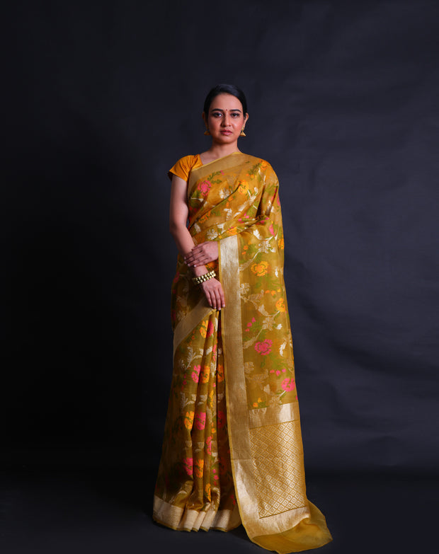 The oily mustard Banarasi kora saree you've described sounds exquisite and vibrant.- BSK010549