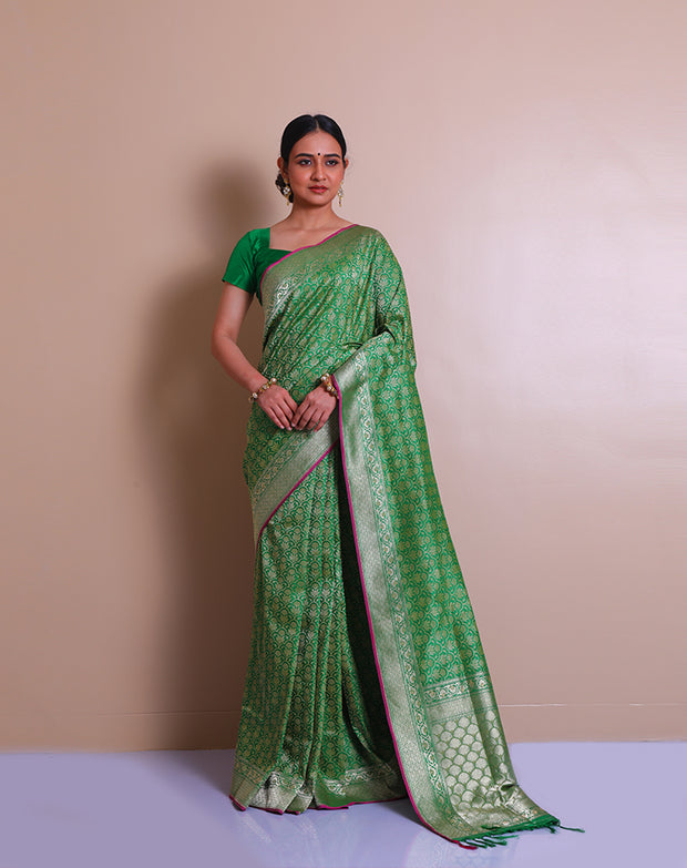 The green Banarsi Handloom silk saree with zari woven details on the border, pallu, - BSK07071