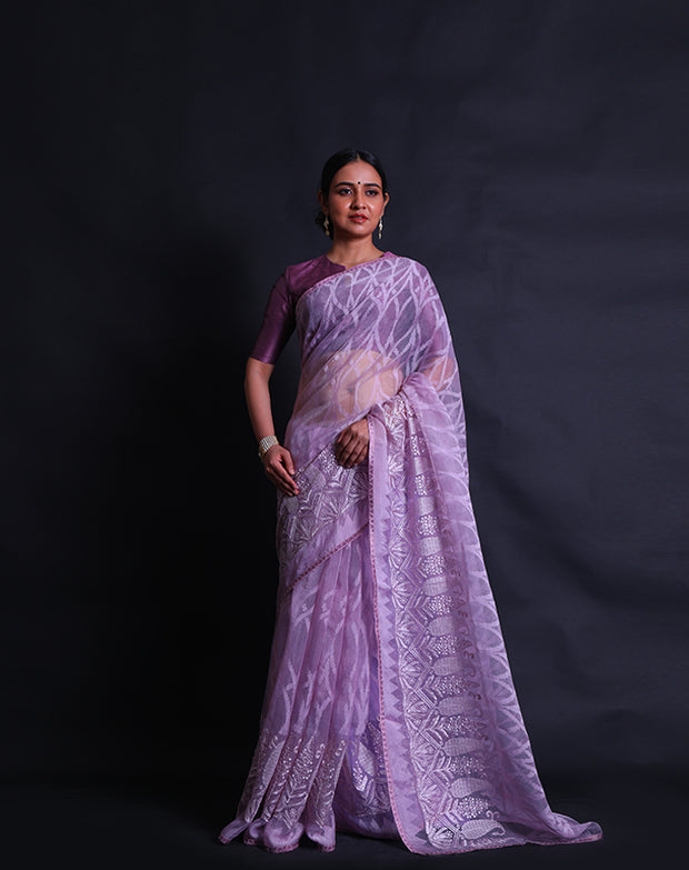 he pink blended saree you're describing features a self-woven design throughout,- BLN01420