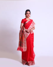 A Red Fancy Cotton saree with a woven border and a Kalamkari printed pallu offers a delightful blend of traditional and contemporary elements - FCT011147