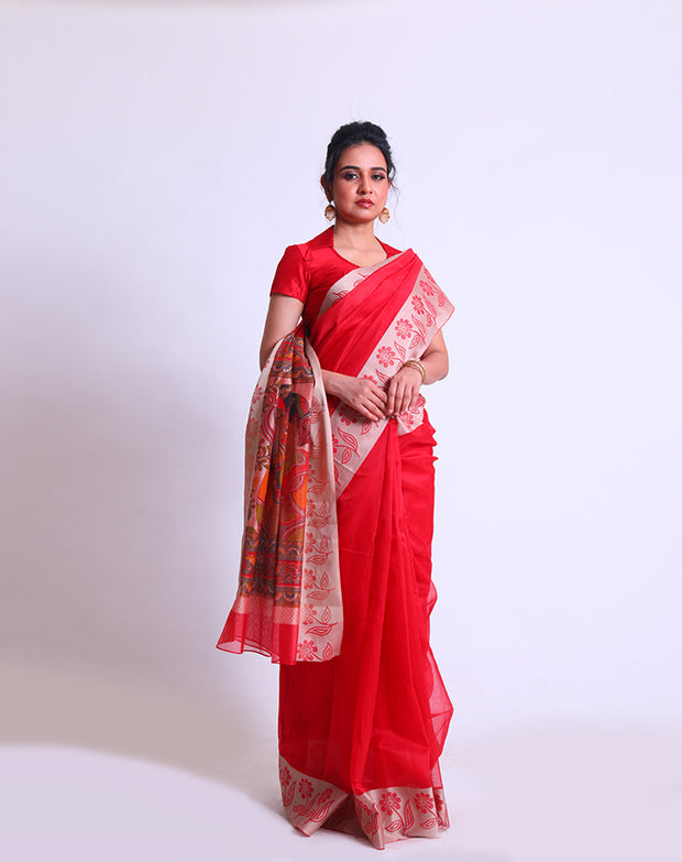 A Red Fancy Cotton saree with a woven border and a Kalamkari printed pallu offers a delightful blend of traditional and contemporary elements - FCT011147