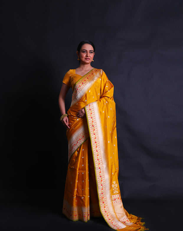 The mustard Banarasi silk saree you're describing sounds exquisite and vibrant.- BSK09081