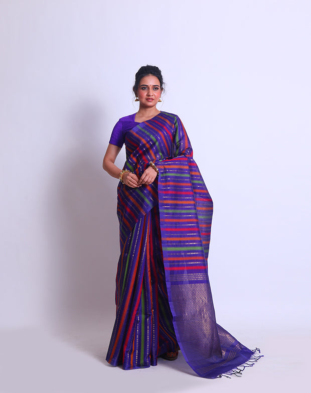 The Purple South Khora saree with colorful lines and triangle-shaped zari lines woven sounds like a delightful blend of traditional and contemporary elements - KSL03118
