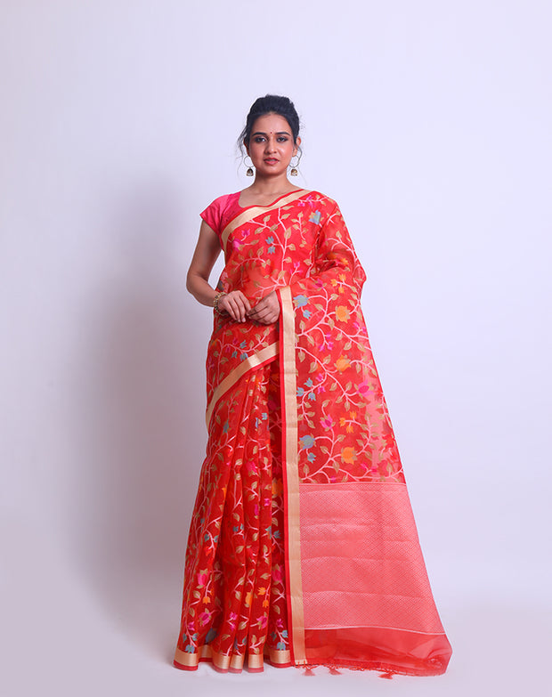 A Tomato Pink Blended Khora saree with a gold zari border and colorful jangla design all over sounds absolutely stunning - CCC02408