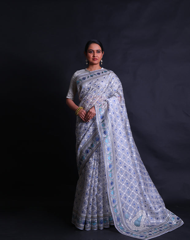 The grey pure organza saree with silver zari and shades of blue thread digitally embroidered all over the drape,- EMB03355