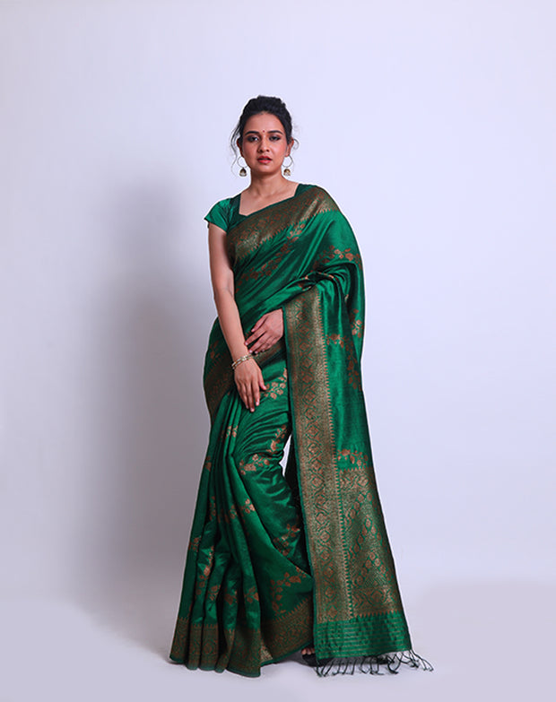 A Bottle Green Raw Silk Handloom Saree with an antique Zari border and pallu - BSK010651