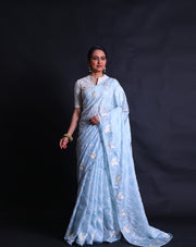 The light blue silk Kota saree adorned with thread and silver zari embroidery all over the drape sounds absolutely stunning,- EMB03354