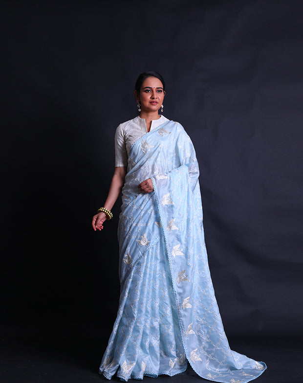 The light blue silk Kota saree adorned with thread and silver zari embroidery all over the drape sounds absolutely stunning,- EMB03354