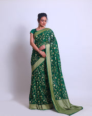 A Bottle Green Khadi Georgette saree with a zari border and pallu - CHG04059