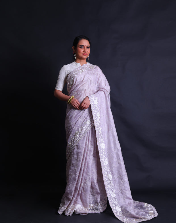 The lilac silk Kota saree with thread embroidery all over the drape sounds lovely and delicate.- EMB03357