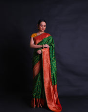 The green Rajkot Patola saree you described sounds stunning and richly detailed.- RPT00842