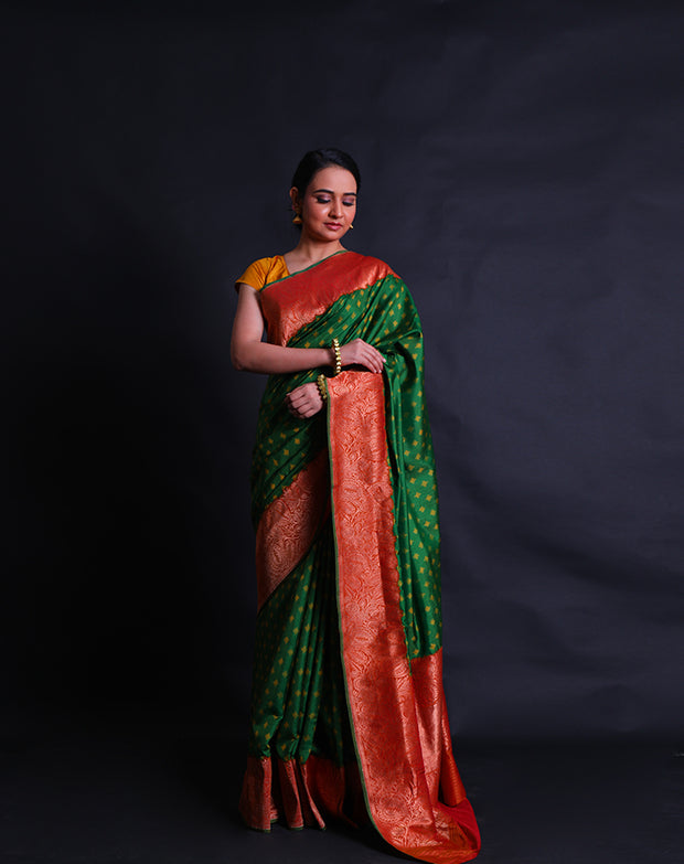 The green Rajkot Patola saree you described sounds stunning and richly detailed.- RPT00842