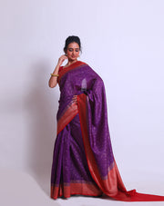 The purple soft Tussar Handloom saree with a red contrast and zari woven border and pallu sounds enchanting - BSK010663