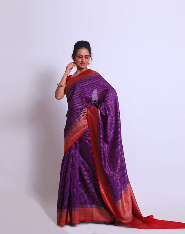 The purple soft Tussar Handloom saree with a red contrast and zari woven border and pallu sounds enchanting - BSK010663