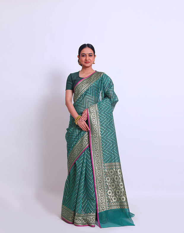 The bottle green fancy cotton saree with thread and zari woven all over the drape - BSK010448