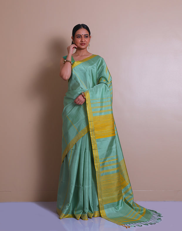 The saree is a lovely image of a sea green Kanjivaram silk saree with mustard accents - KSL03110