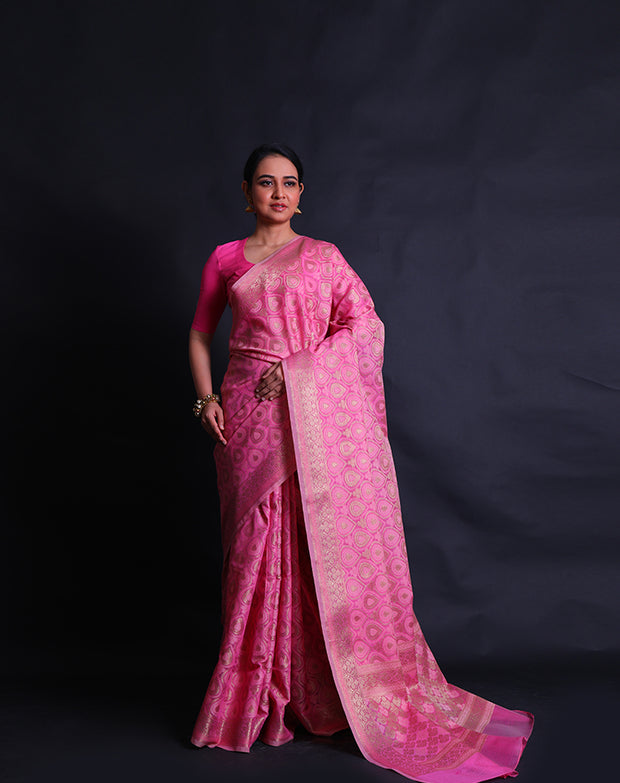 A pink cotton saree with self-woven designs and zari added throughout the drape,- FCT011114