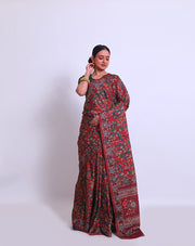 The maroon semi saree with Kalamkari print on the border, pallu, and all over the drape sounds beautiful - BLN00986