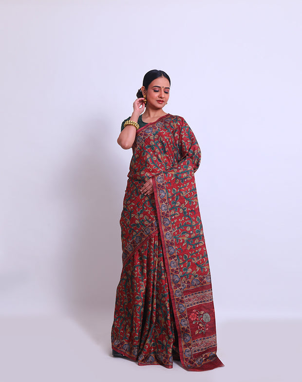 The maroon semi saree with Kalamkari print on the border, pallu, and all over the drape sounds beautiful - BLN00986