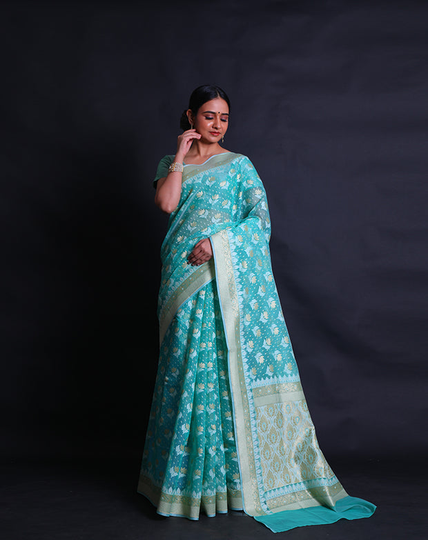 The sea green kora cotton saree with lotus and leaf designs woven in thread and zari sounds exquisite, - BSK010448