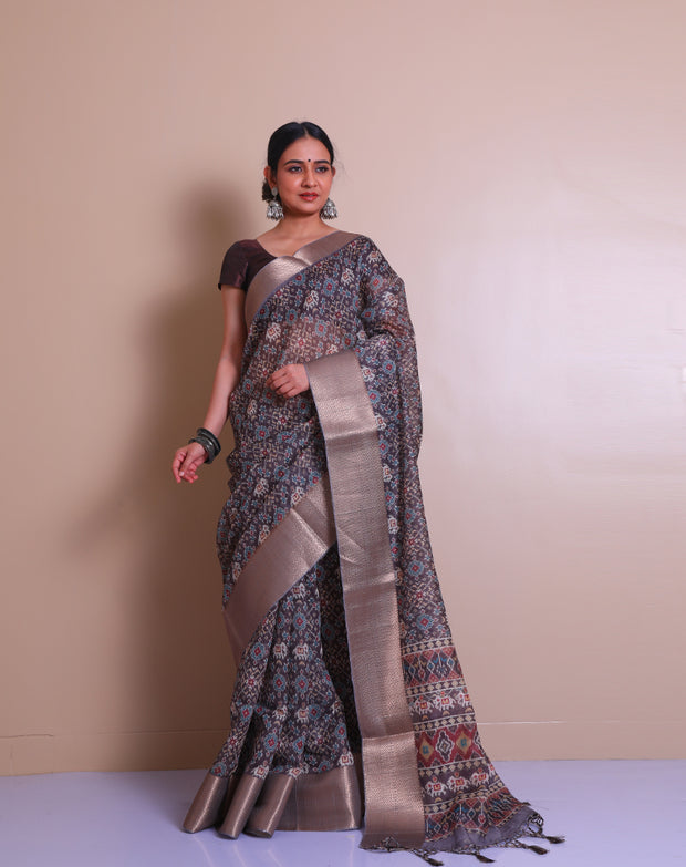 The linen brown blended saree with traditional print all over the drape and pallu sounds both classic and elegant. - BLN00967