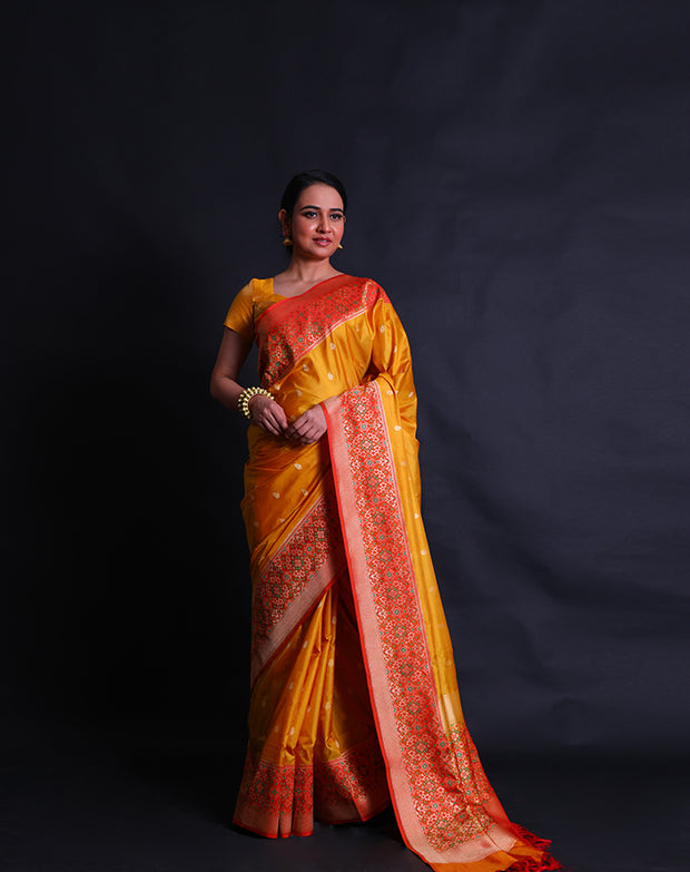 The mustard Banarasi silk saree you're describing sounds absolutely stunning.- BSK010581