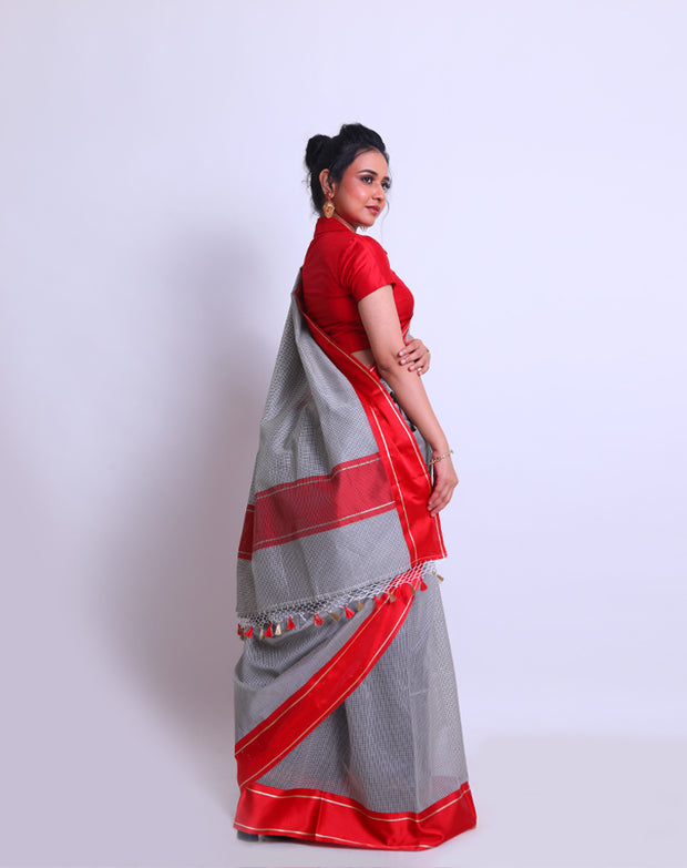 A White Cotton Saree with a checks design all over the drape offers a classic and timeless look - FCT011149