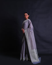 The grey Banarasi cotton saree you're describing sounds sophisticated and visually appealing.- FCT011110