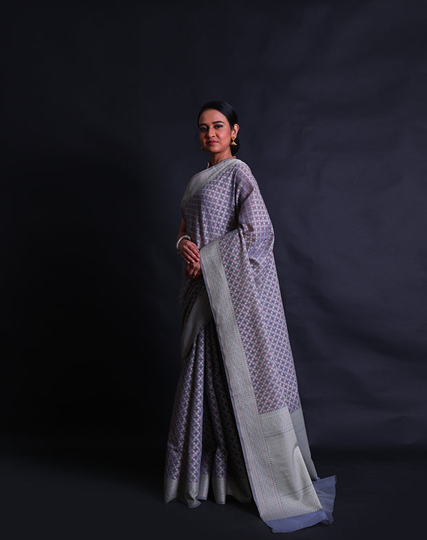 The grey Banarasi cotton saree you're describing sounds sophisticated and visually appealing.- FCT011110