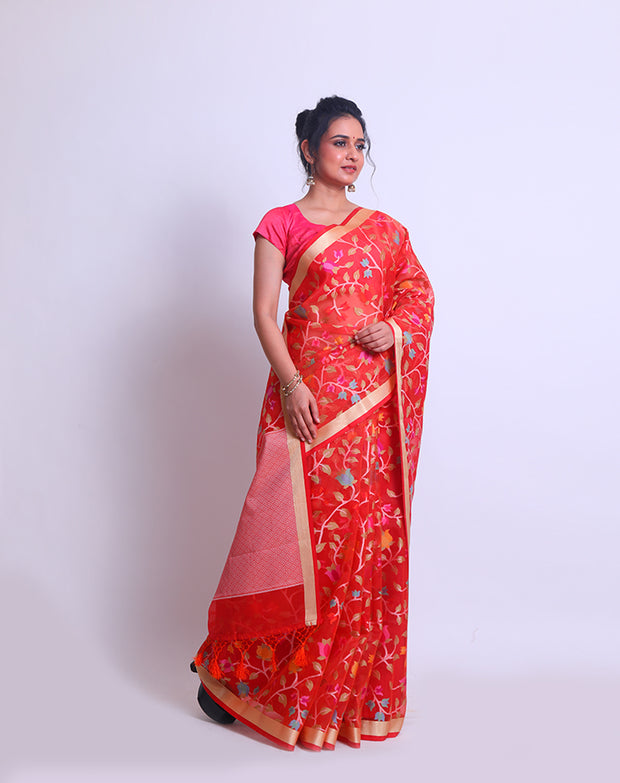 A Tomato Pink Blended Khora saree with a gold zari border and colorful jangla design all over sounds absolutely stunning - CCC02408