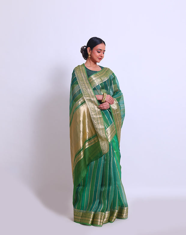 The green organza saree with zari vertical lines woven all over the drape sounds elegant and sophisticated - BSK010624