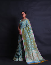 The Green Banarasi silk saree you're describing sounds exquisite and intricate.- BSK010452