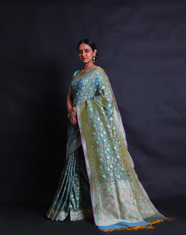 The Green Banarasi silk saree you're describing sounds exquisite and intricate.- BSK010452
