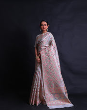 The beige tissue cotton saree with zari and pink thread woven in flower design all over the drape sounds elegant and refined,- FCT011109