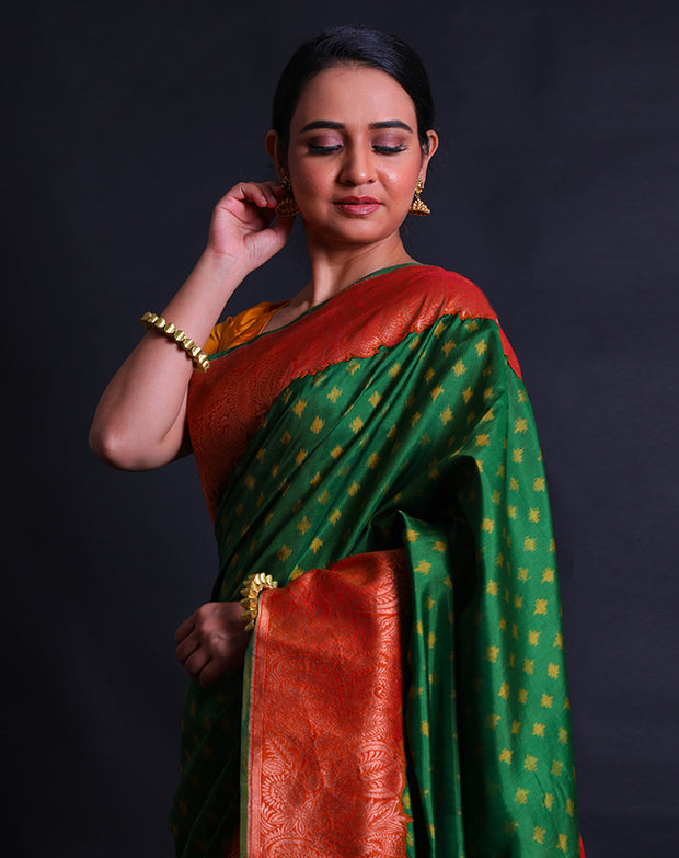 The green Rajkot Patola saree you described sounds stunning and richly detailed.- RPT00842