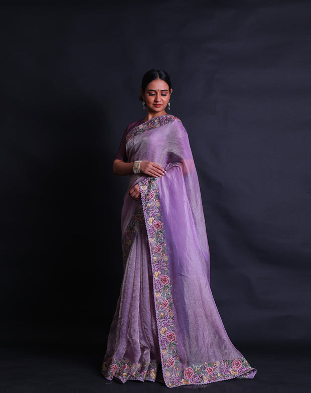 The mauve tissue saree you've described sounds absolutely lovely, especially with the petit point embroidery adding delicate details.- EMB03359