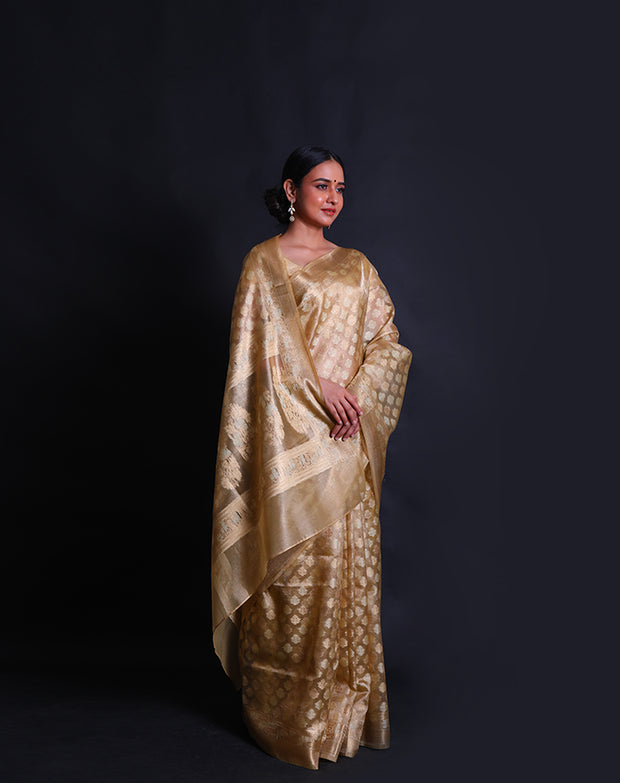 The gold cotton saree you've described sounds elegant and luxurious,- FCT011109