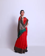 A Red Handloom Tussar saree with a green contrast and antique Zari woven on the border and pallu sounds stunning - BSK010681