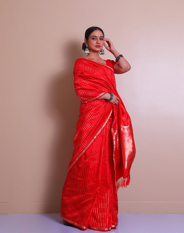 The red Banarasi handloom silk saree with small zari border and tiny zari motifs in line designs all over the drape, - BSK010760