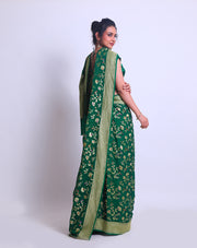 A Bottle Green Khadi Georgette saree with a zari border and pallu - CHG04059