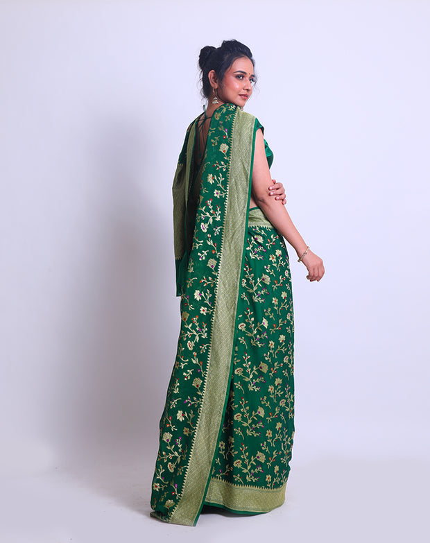 A Bottle Green Khadi Georgette saree with a zari border and pallu - CHG04059