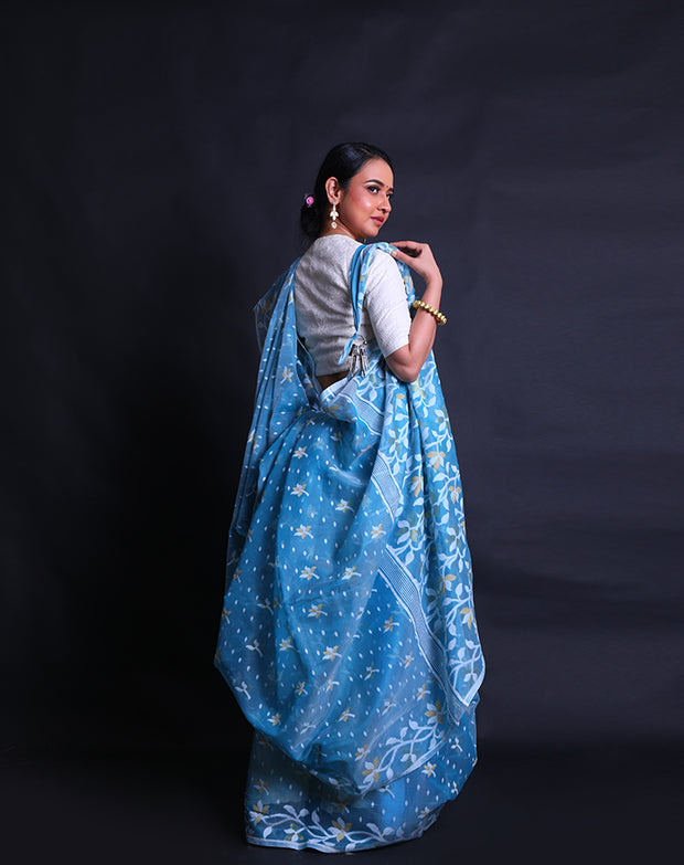 The blue cotton saree adorned with Daccai design woven intricately all over the drape,- FCT011111