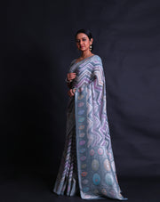 The grey semi Khadi georgette saree with light shades and zari lines in a zig-zag design,- CHG04011